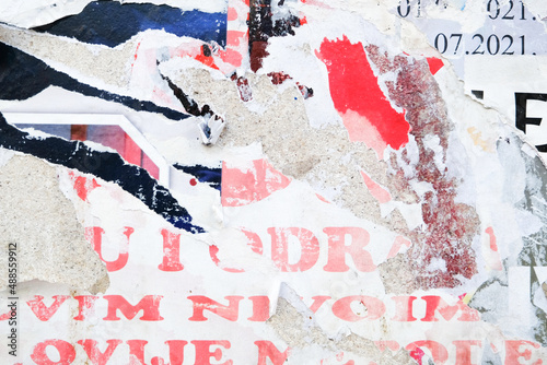 Ripped street poster background. Torn paper, abstract texture. 