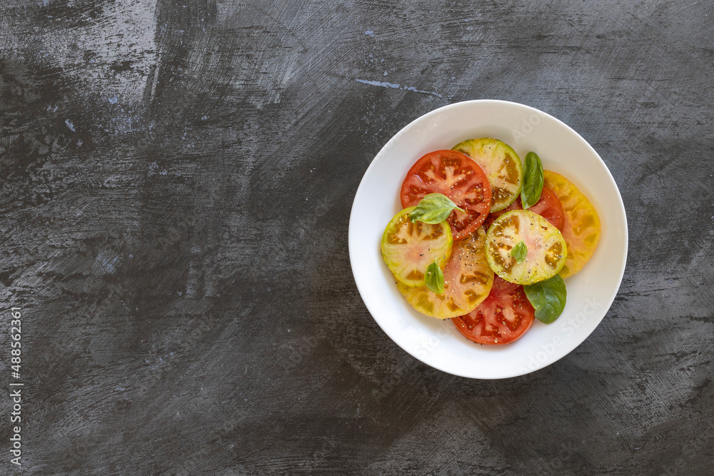 A Bowl of Heirloom Tomato Salad with room for copy