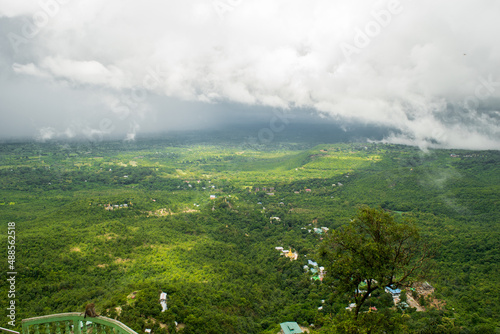 The view of countryside and forests as seen from the top of Mount Popa, dormant volcano and pilgrim site in Myanmar, Burma, SE Asia photo