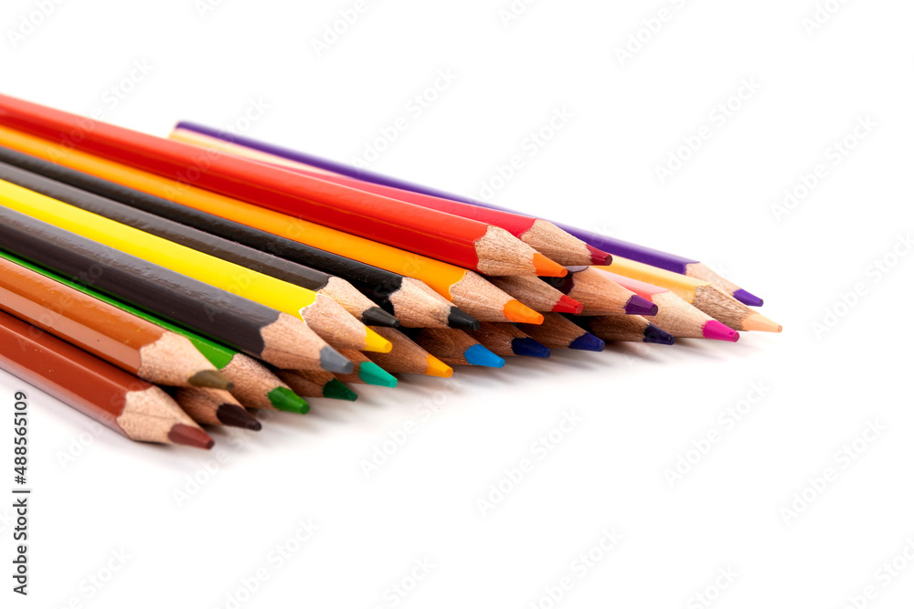 Many multicolored pencils, isolated on white background with copy space. Art and education background. Many multicolored pencils, isolated on white background with copy space. Art and education background.