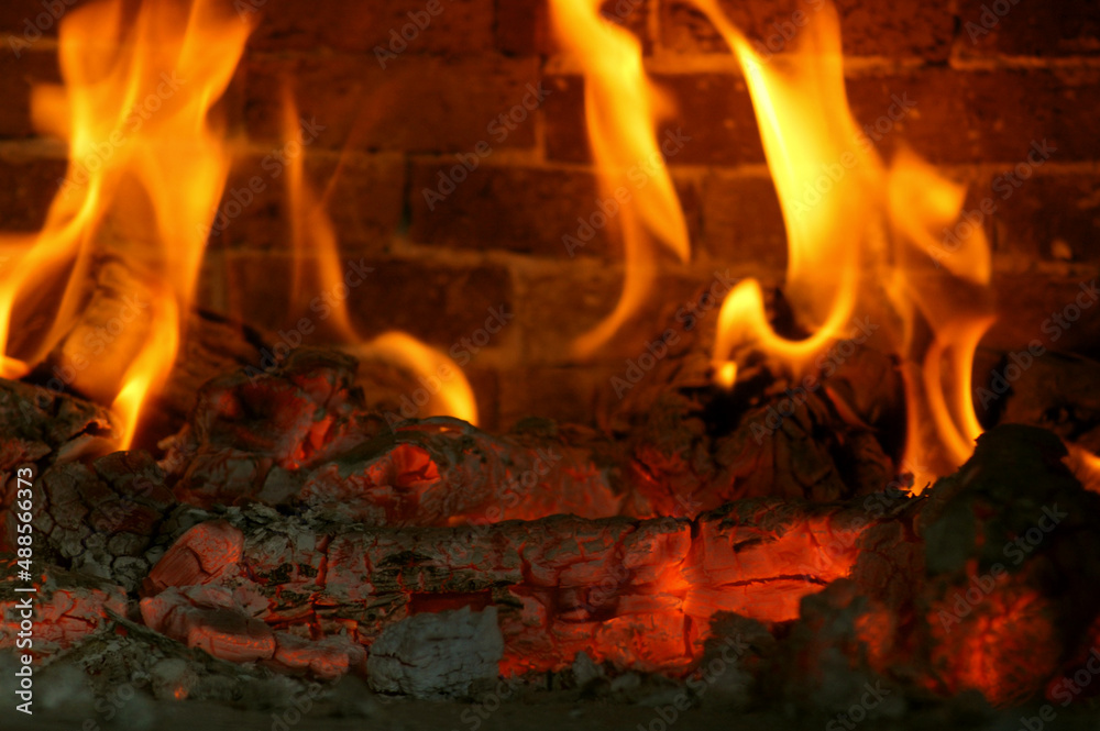 Firewood and embers.
The blazing flames of the fire Flames in the fireplace. Firewood and embers.
The blazing flames of the fire Flames in the fireplace.