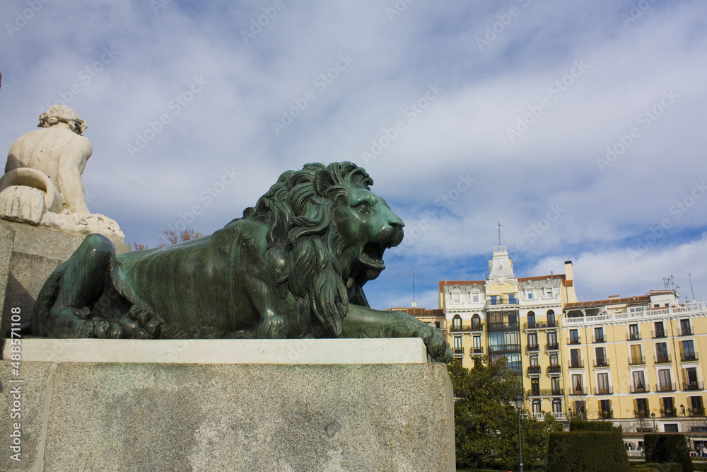 Fragment of monument to Felipe IV with a lion at Plaza de Oriente in Madrid, Spain