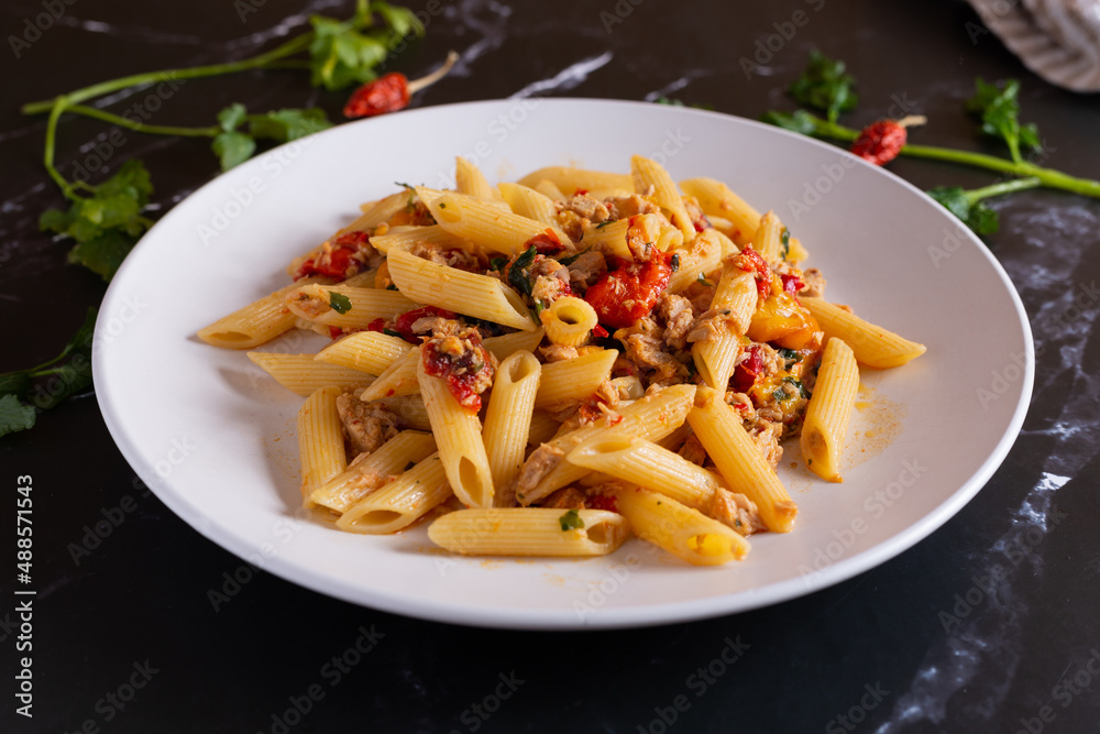 Penne with tuna and peppers. Easy and quick recipe typical of Mediterranean cuisine Penne with tuna and peppers. Easy and quick recipe typical of Mediterranean cuisine