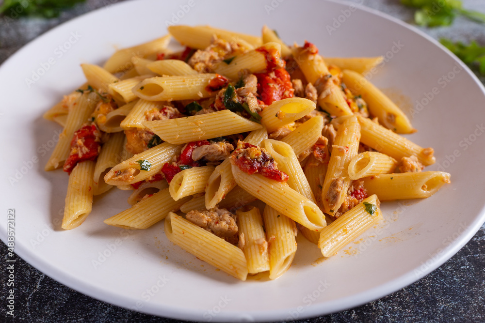 Penne with tuna and peppers. Easy and quick recipe typical of Mediterranean cuisine Penne with tuna and peppers. Easy and quick recipe typical of Mediterranean cuisine