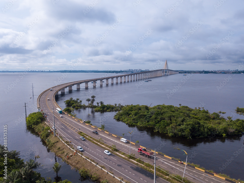 Fototapeta premium Beautiful drone aerial view of Negro river, trees and bridge 
