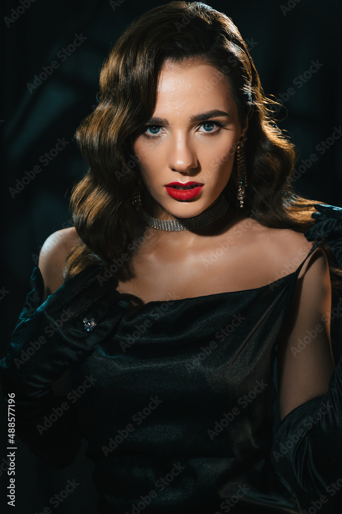 Portrait of woman in style of classic retro Hollywood movie of 1950s. Elegant young girl with a stylish hairstyle and makeup. Concept of vintage female looking Portrait of woman in style of classic retro Hollywood movie of 1950s. Elegant young girl with a stylish hairstyle and makeup. Concept of vintage female looking