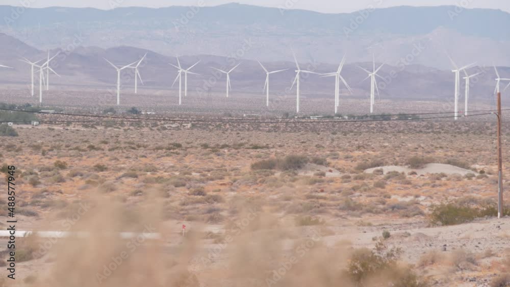 Windmills turbine rotating, wind farm or power plant, alternative green renewable energy generators, industrial field in California desert USA. Electricity generation on windfarm. El Centro, Kumeyaay. Windmills turbine rotating, wind farm or power plant, alternative green renewable energy generators, industrial field in California desert USA. Electricity generation on windfarm. El Centro, Kumeyaay.