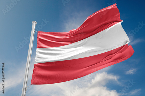 Austrian Flag is Waving Against Blue Sky