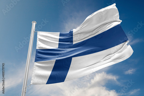 Finland Flag is Waving Against Blue Sky