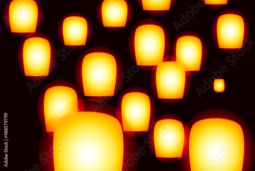 glowing paper lanterns are flying in the air