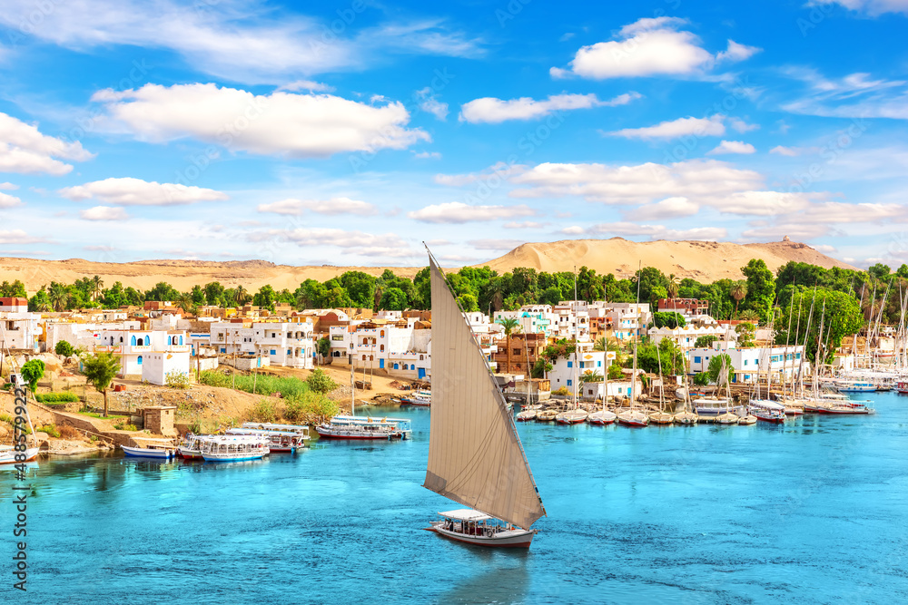 Traditional buildings of Aswan, the Nile and sailboats, Egypt