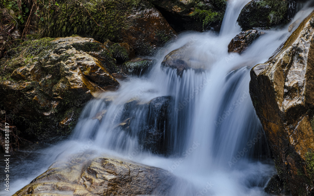 Fototapeta premium Autumn at the Aitzondo waterfall, Aiako Harriak Natural Park, Euskadi