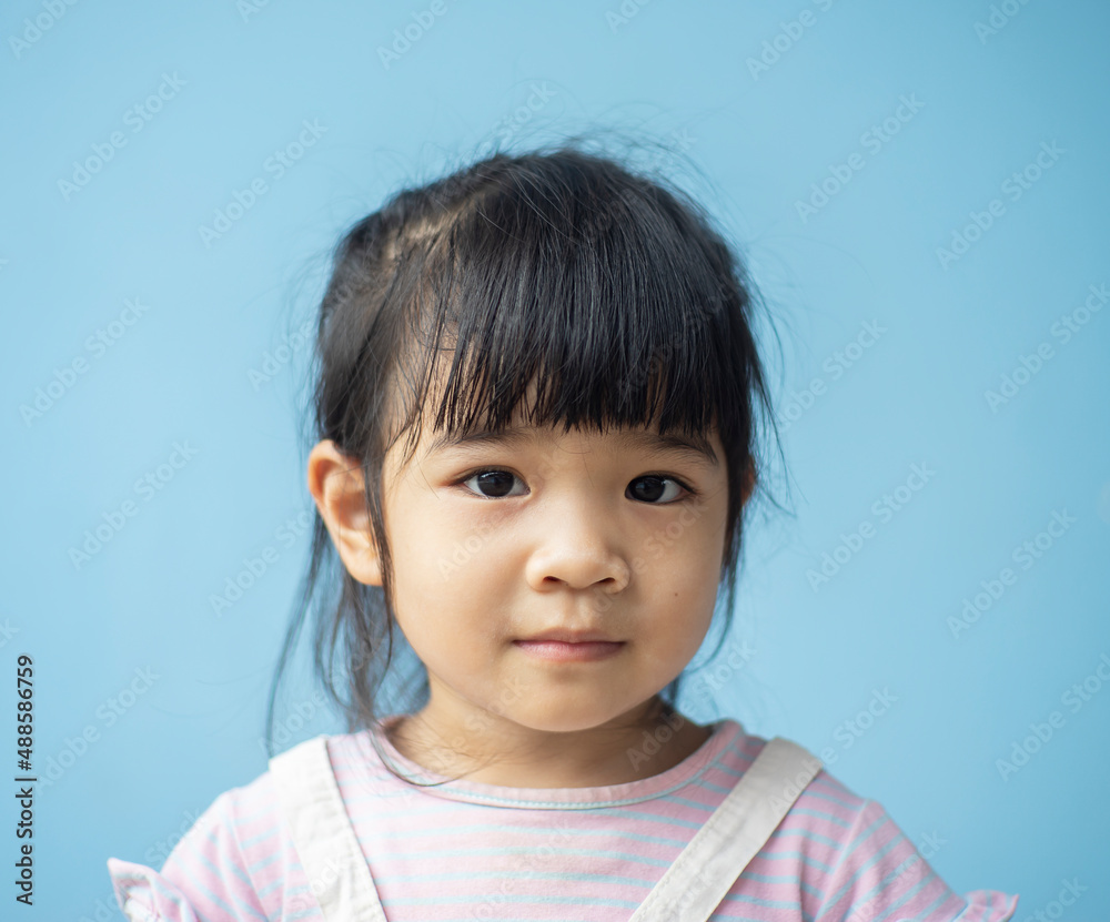 A headshot portrait of a cheerful baby Asian woman, a cute toddler little girl with adorable bangs hair, a child wearing a purple sweater smiling and looking to the camera. A headshot portrait of a cheerful baby Asian woman, a cute toddler little girl with adorable bangs hair, a child wearing a purple sweater smiling and looking to the camera.