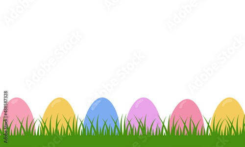 Colorful decorated easter eggs on the grass. Background banner.