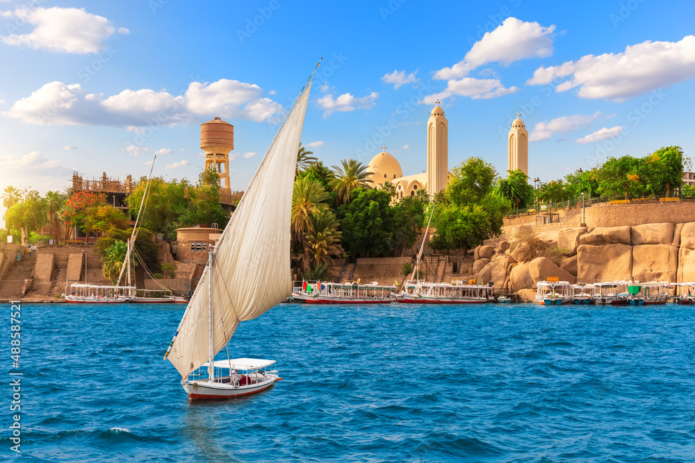 A Sailboat in The Nile near the Coptic Orthodox Cathedral of the Archangel Michael, Aswan, Egypt