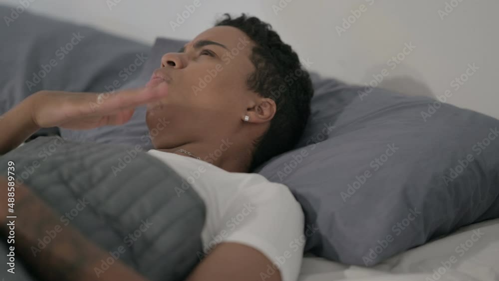 African Woman Coughing while Sleeping in Bed African Woman Coughing while Sleeping in Bed
