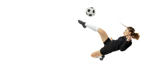 Attacking player. One sportive girl, female soccer player training with football ball isolated on white studio background. Sport, action, motion, fitness
