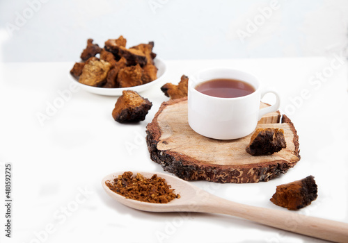 Healthy drink coffee from chaga mushroom on a white background. Top view. Copt spaes.
