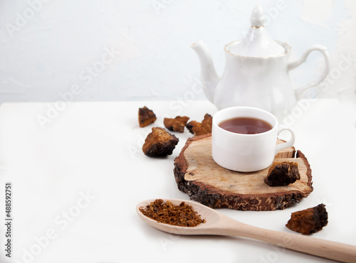 Healthy drink coffee from chaga mushroom on a white background. Top view. Copt spaes.