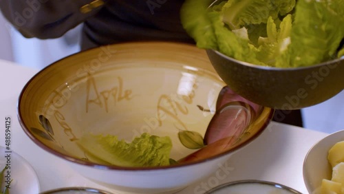Fresh green salad leaves in a bowl