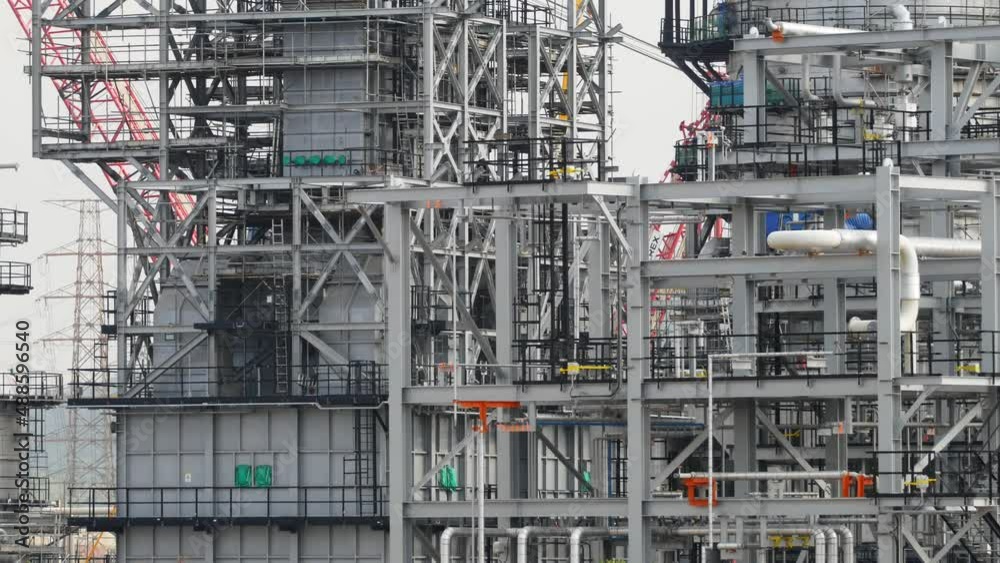 The external engineering structure of the process area of a large oil refinery under construction, Smooth panning video The external engineering structure of the process area of a large oil refinery under construction, Smooth panning video