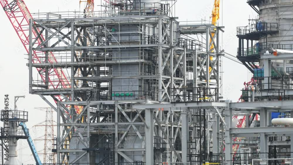A large engineering structure of a chemical and oil refinery is currently under construction. A large engineering structure of a chemical and oil refinery is currently under construction.