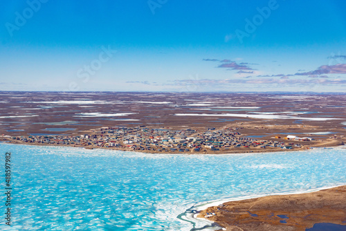 an aerial view of the arctic community of cambridge bay, nunavut in springtime photo