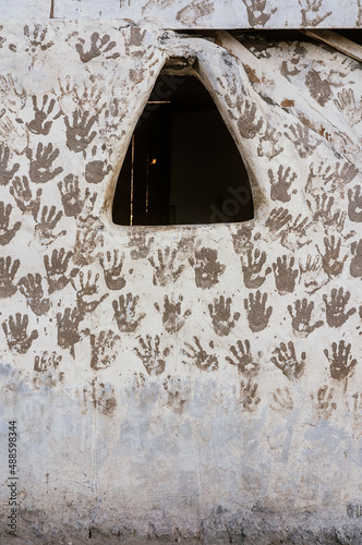 Handprints on shabby house in Egypt