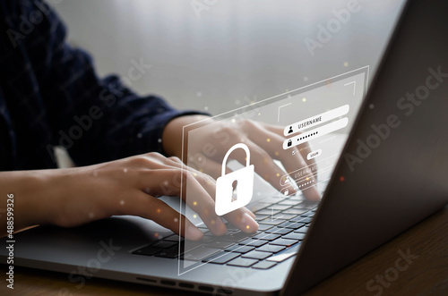 A business man sits in search of an anonymous hacker for digital crime prevention information. Security of personal information Banking and finance are all important aspects of cybersecurity. photo