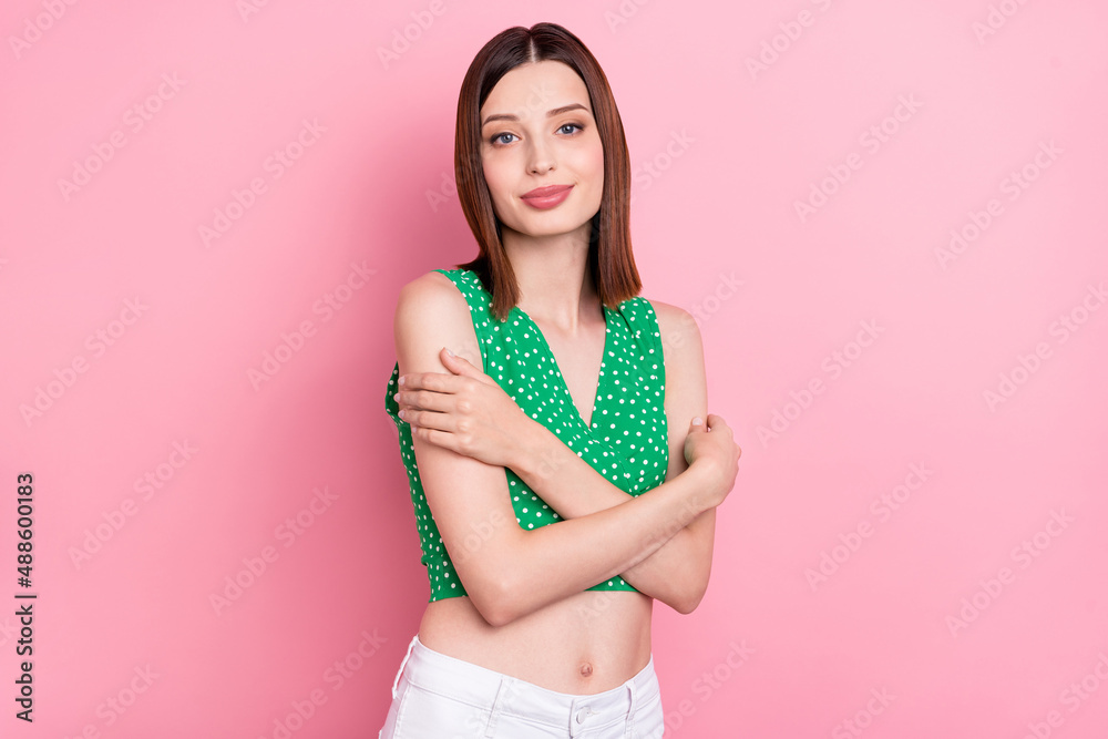 Naklejka premium Photo of young charming lady hug herself dream enjoy bodycare soft isolated over pink color background