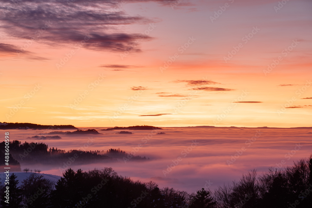 Sunset above a sea of fog