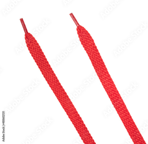 Red fabric shoelaces isolated on white background. close-up
