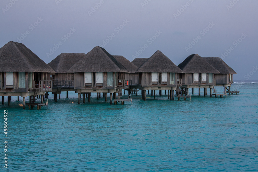 Water Bungalows in Turquoise Sea at Maldives Water Bungalows in Turquoise Sea at Maldives