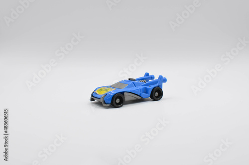 plastic toy racing car on a white background