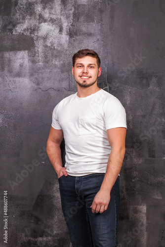 Close up portrait of a young guy in a white t-shirt