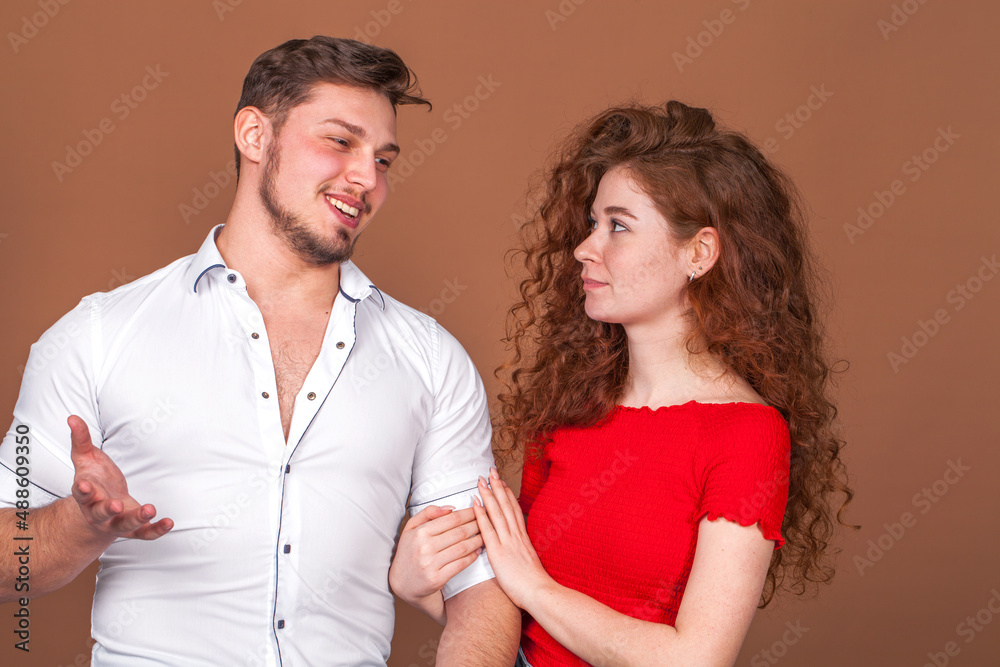 Beautiful red hair girl posing with her boyfriend
