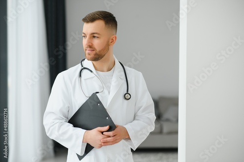 handsome male doctor portrait in office