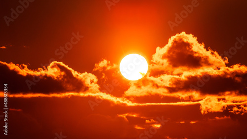 Fototapeta Naklejka Na Ścianę i Meble -  Beautiful colorful orange sky with clouds at sunset