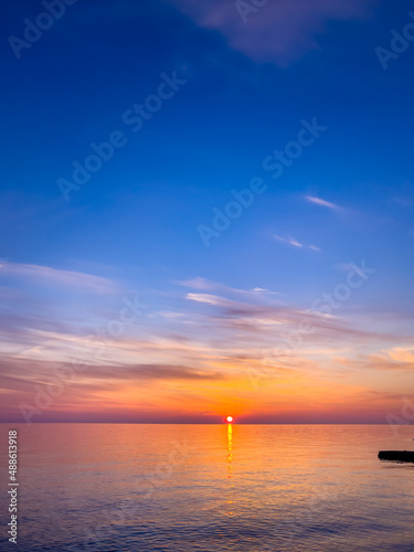  Summer sea design template. Beautiful sunset on tropical beach  and sunlight on horizon © EwaStudio