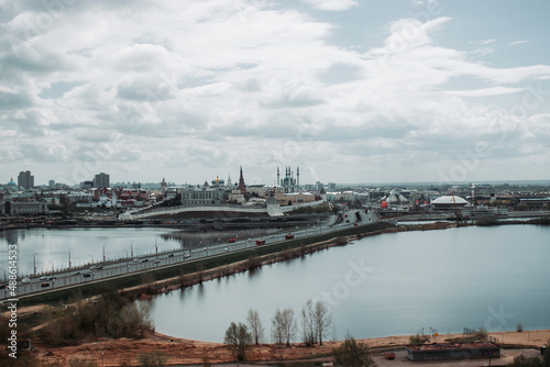 the city of Kazan is high with a view of the main Kazanka river and a long bridge during the day in cloudy weather