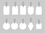 Paper price tags or labels of various shapes. Gift tags with blank white background. Designer sticker. Place for prices and discounts. Set of icons isolated on a gray background. Vector