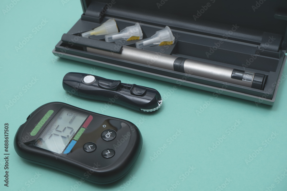 syringe pen and glucometer, insulin pen and needles. diabetic set