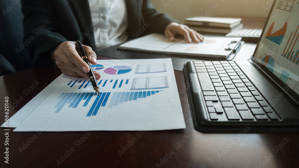 Administrator business man financial inspector and secretary making report calculating balance. Internal Revenue Service checking document. Audit concept Administrator business man financial inspector and secretary making report calculating balance. Internal Revenue Service checking document. Audit concept
