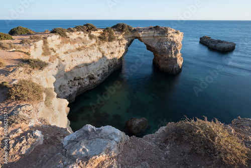 Coastal cliffs of Algarve, Lagoa, Portugal Summer season in most popular tourist region.