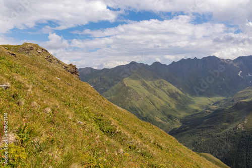 A hiking trail leading to Chubedishi viewpoint. There is an amazing view on the Shkhara Glacier,near the village Ushguli the Greater Caucasus Mountain Range in Georgia, Svaneti Region.Meadow, Flowers