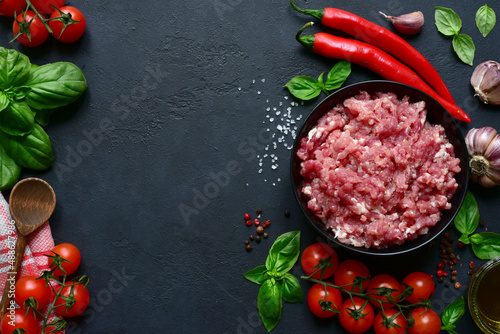 Homemade minced meat with vegetables and spices. Top view with copy space.