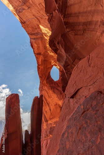 Natural Arch with a blue sky in Monument Valley photo