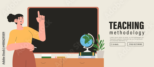 Female teacher in classroom. Learning, advanced tranining or teaching methodology concept. School teacher stand at blackboards in classroom. Lecturer teaching in class. Professors at chalkboards.