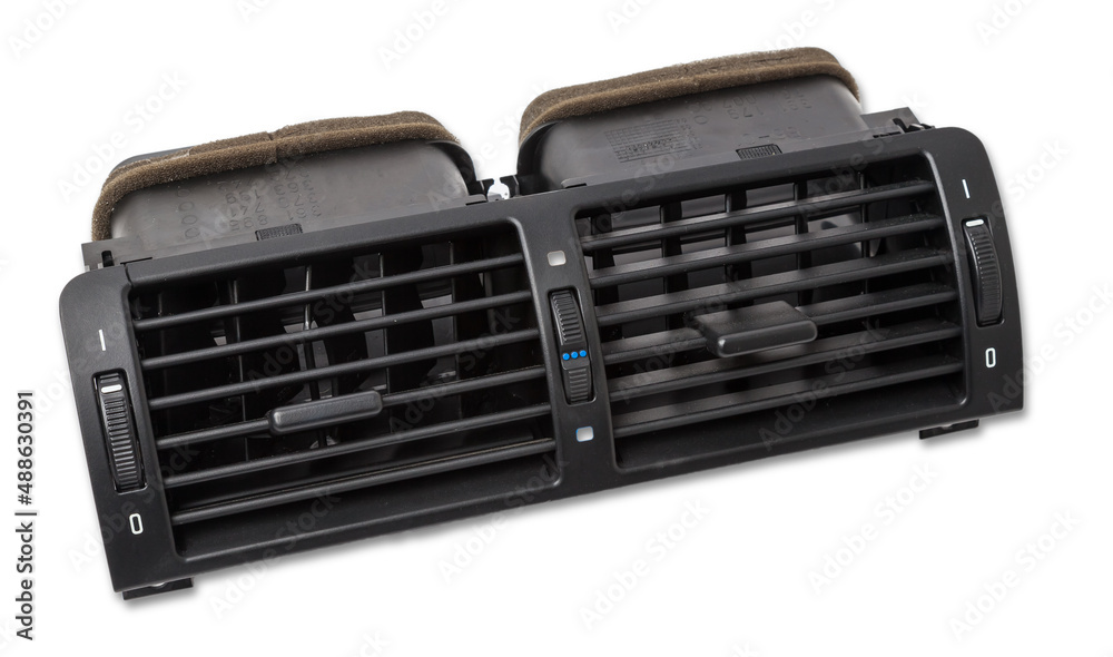 A close-up view of a part of the interior of a modern car with a view of the ventilation deflector of the heater for heating and cooling the passenger compartment. Used auto part catalog from junkyard A close-up view of a part of the interior of a modern car with a view of the ventilation deflector of the heater for heating and cooling the passenger compartment. Used auto part catalog from junkyard