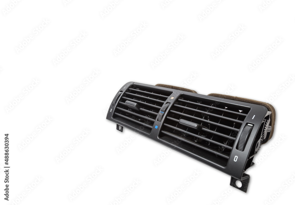 A close-up view of a part of the interior of a modern car with a view of the ventilation deflector of the heater for heating and cooling the passenger compartment. Used auto part catalog from junkyard A close-up view of a part of the interior of a modern car with a view of the ventilation deflector of the heater for heating and cooling the passenger compartment. Used auto part catalog from junkyard